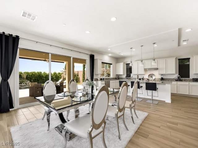 dining room with light wood-type flooring