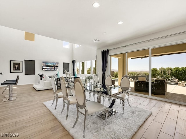 dining space with light hardwood / wood-style flooring