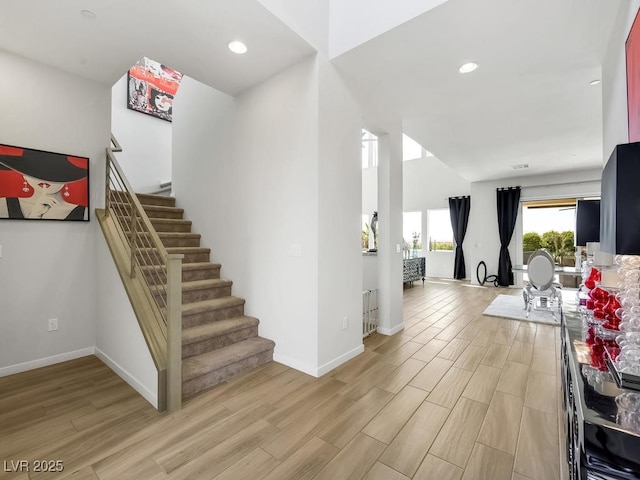 staircase with wood-type flooring