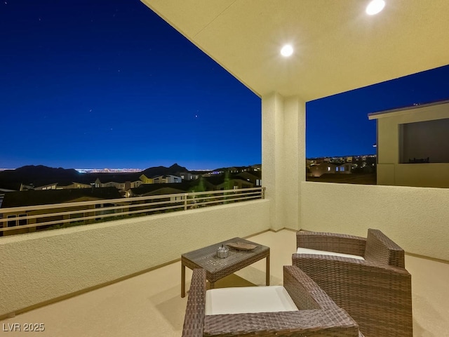 patio at night with a balcony