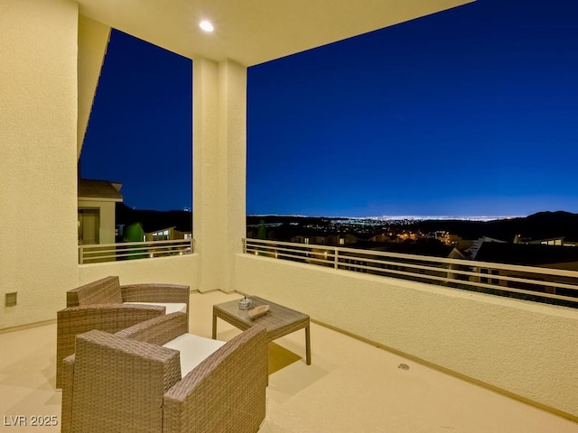 patio at night with a balcony