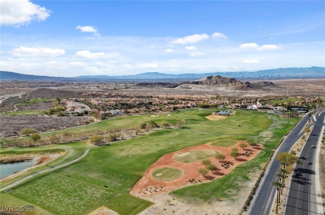 drone / aerial view with a water and mountain view