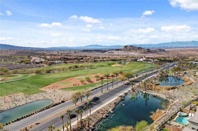 drone / aerial view featuring a water and mountain view