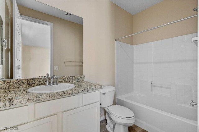 full bathroom with toilet, vanity, and bathtub / shower combination