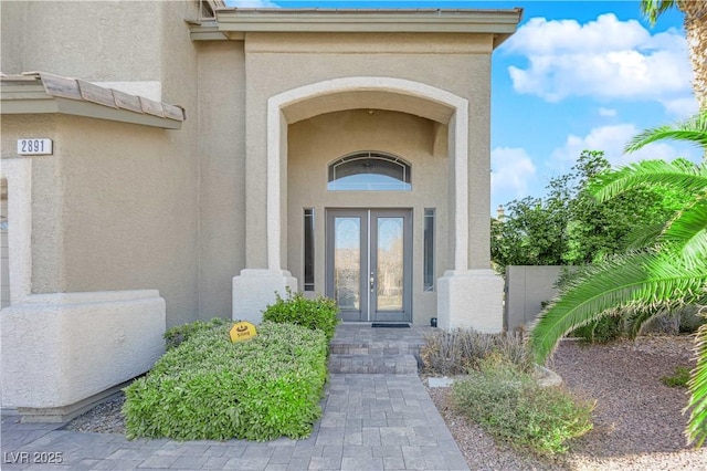 property entrance featuring french doors