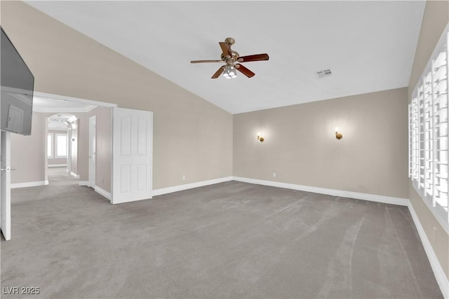 spare room with lofted ceiling, carpet floors, and ceiling fan