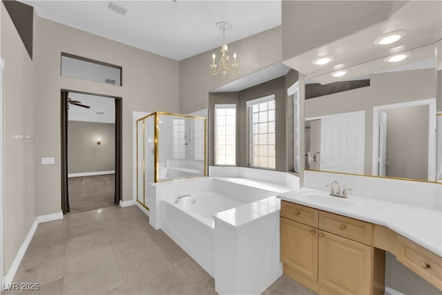 bathroom with independent shower and bath, vanity, tile patterned flooring, and a notable chandelier