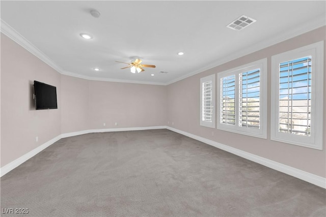 carpeted empty room with crown molding and ceiling fan