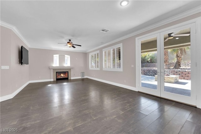 unfurnished living room featuring french doors, ceiling fan, ornamental molding, and dark hardwood / wood-style floors