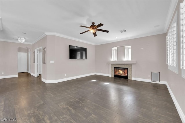 unfurnished living room with ornamental molding, dark wood-type flooring, and ceiling fan