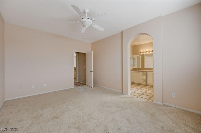 empty room with light carpet and ceiling fan