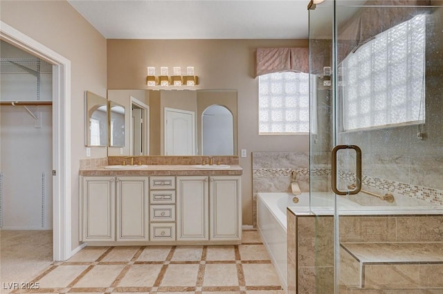 bathroom featuring vanity and plus walk in shower