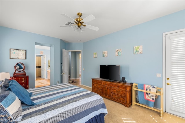 carpeted bedroom with ceiling fan and ensuite bathroom