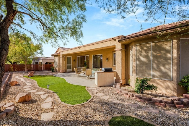 rear view of house with a patio area