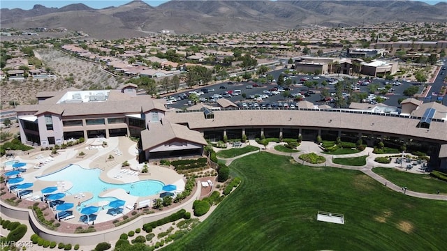 birds eye view of property featuring a mountain view