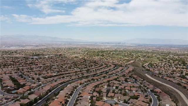 birds eye view of property with a mountain view