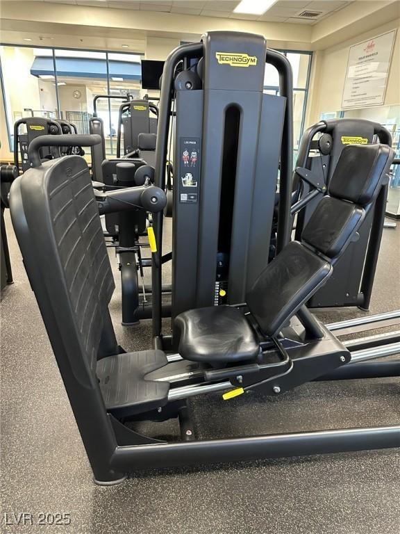 workout area featuring a drop ceiling