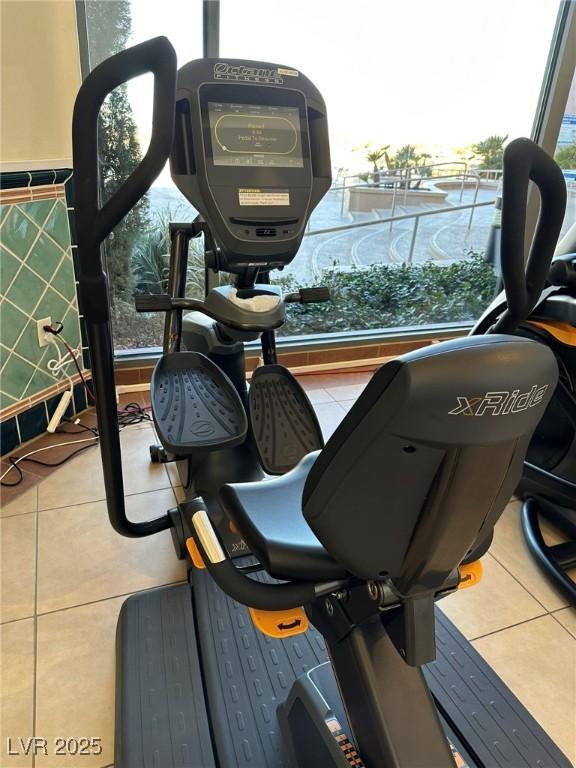 workout room with tile patterned flooring