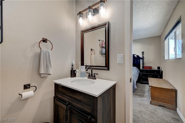 bathroom with vanity and a textured ceiling