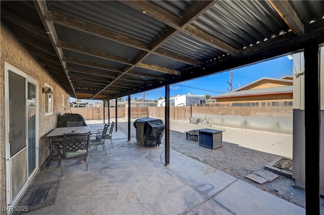 view of patio / terrace with a grill and an outdoor fire pit