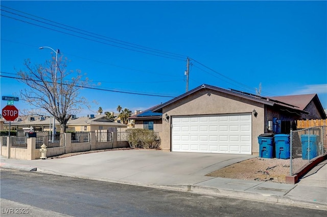 ranch-style home featuring a garage