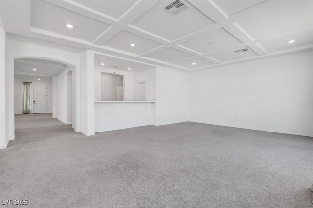 spare room featuring coffered ceiling and carpet floors