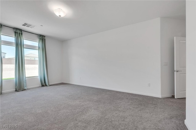 empty room featuring light colored carpet