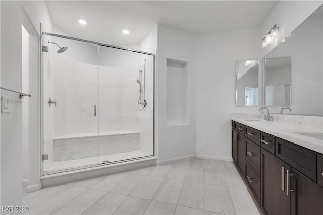 bathroom featuring vanity, an enclosed shower, and tile patterned flooring