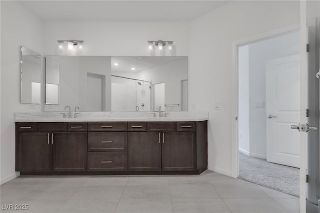 bathroom featuring vanity, an enclosed shower, and tile patterned flooring