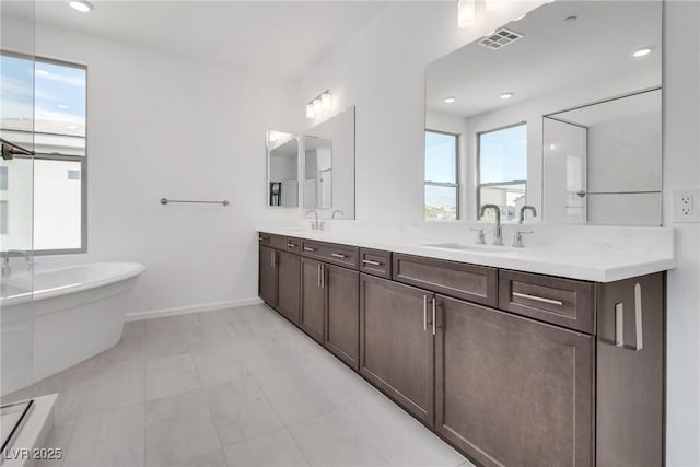 bathroom featuring vanity and a bathtub