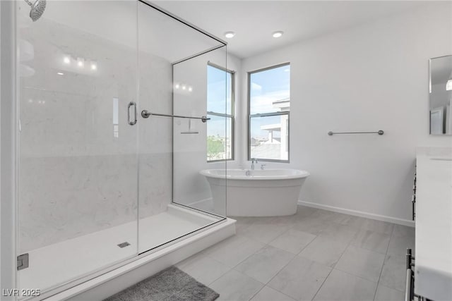 bathroom featuring plus walk in shower and vanity