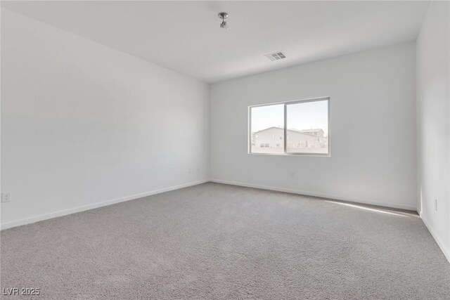 empty room featuring carpet floors