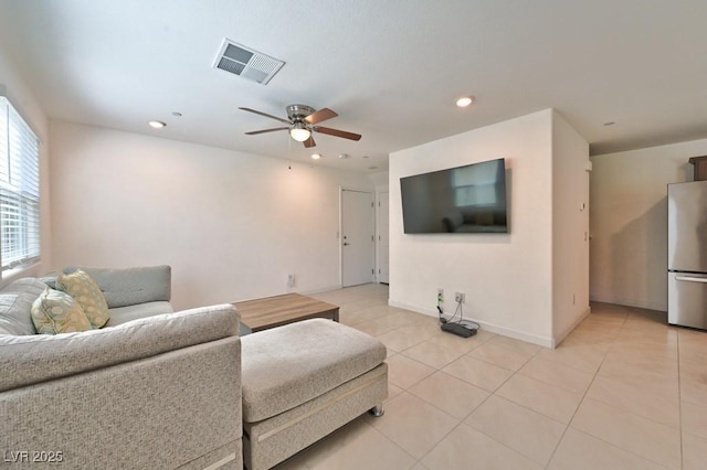 tiled living room featuring ceiling fan