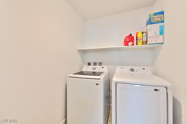 clothes washing area with separate washer and dryer