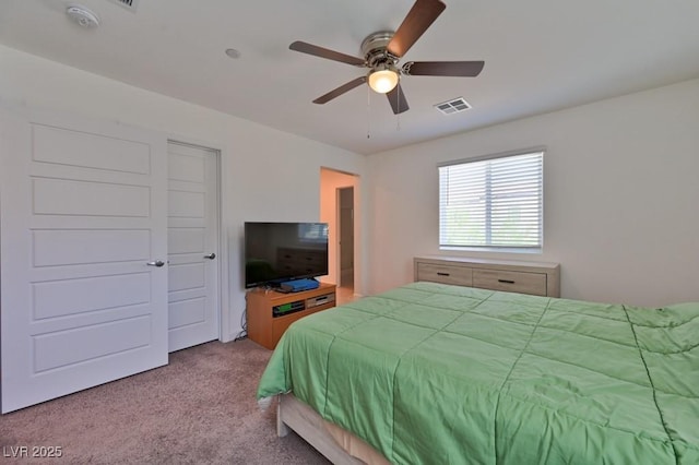 bedroom featuring ceiling fan and light colored carpet