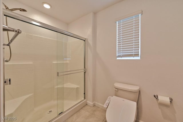 bathroom with toilet, an enclosed shower, and tile patterned flooring