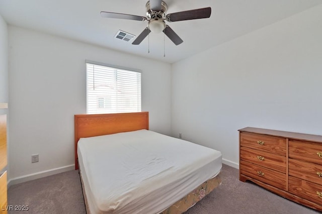 bedroom featuring dark colored carpet and ceiling fan