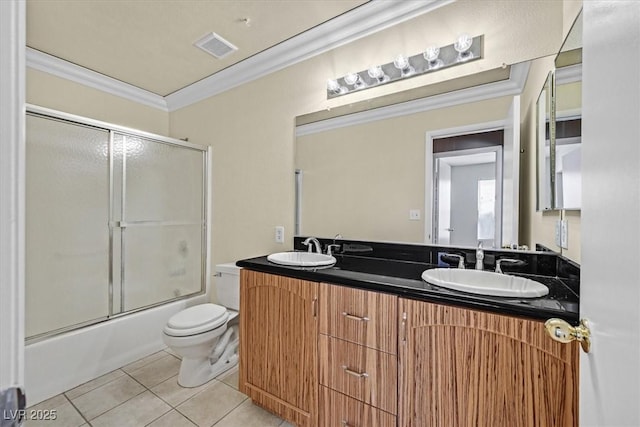 full bathroom featuring tile patterned floors, toilet, crown molding, shower / bath combination with glass door, and vanity