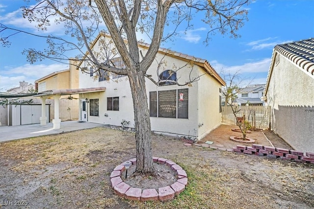 back of house with a patio area