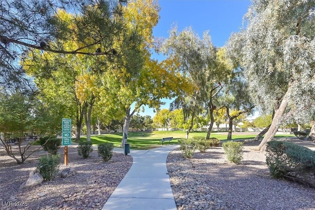 view of home's community featuring a lawn