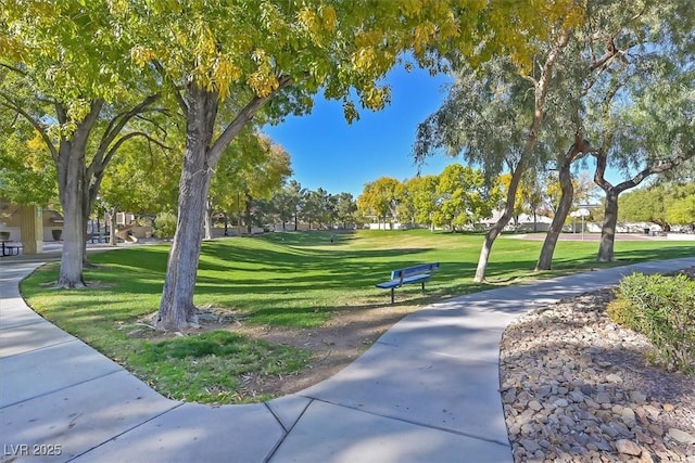 view of property's community featuring a yard