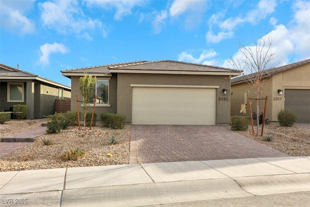 view of front of property with a garage