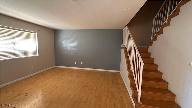 stairway with hardwood / wood-style flooring