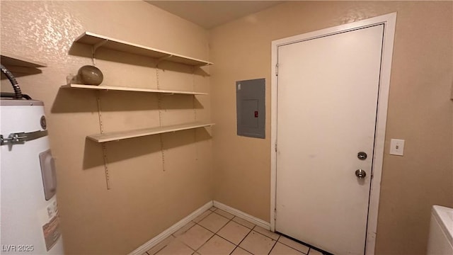 washroom with electric panel, water heater, and light tile patterned floors