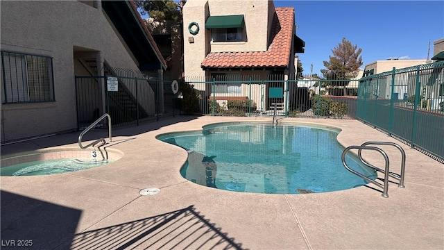 view of swimming pool with a patio area