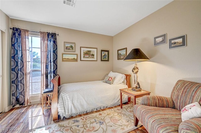 bedroom with light hardwood / wood-style flooring