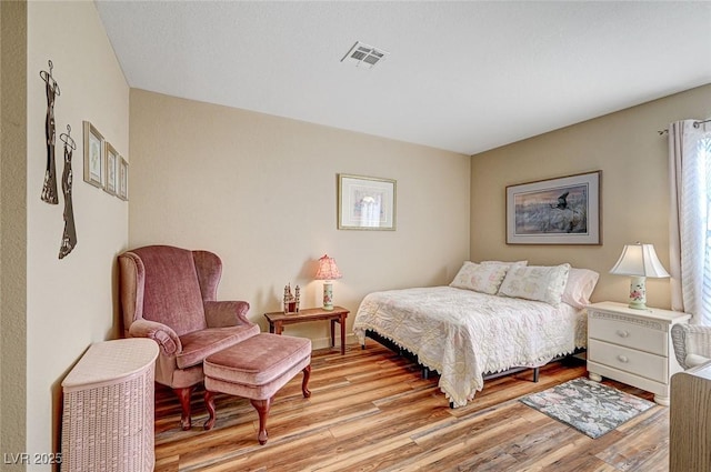 bedroom with light hardwood / wood-style flooring