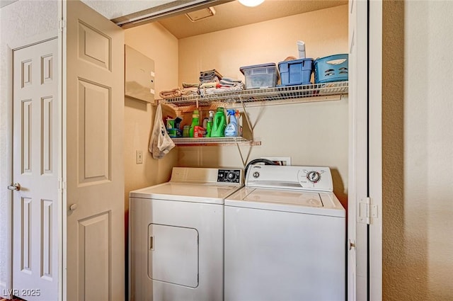 washroom featuring independent washer and dryer