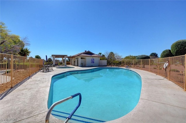 view of swimming pool featuring a community hot tub and a patio area