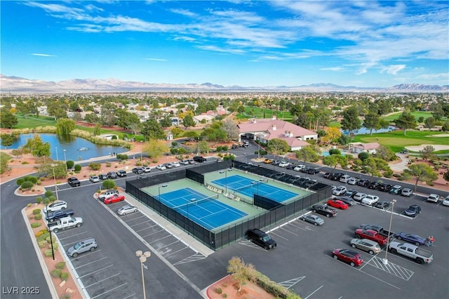 birds eye view of property featuring a water and mountain view